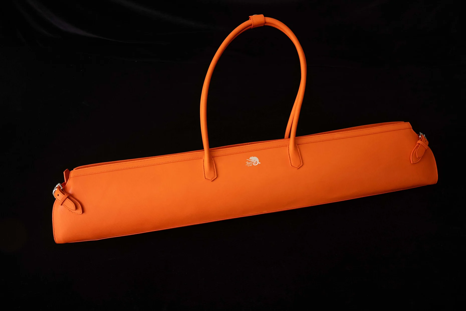 Orange JazzCue cue bag photographed on a black studio background